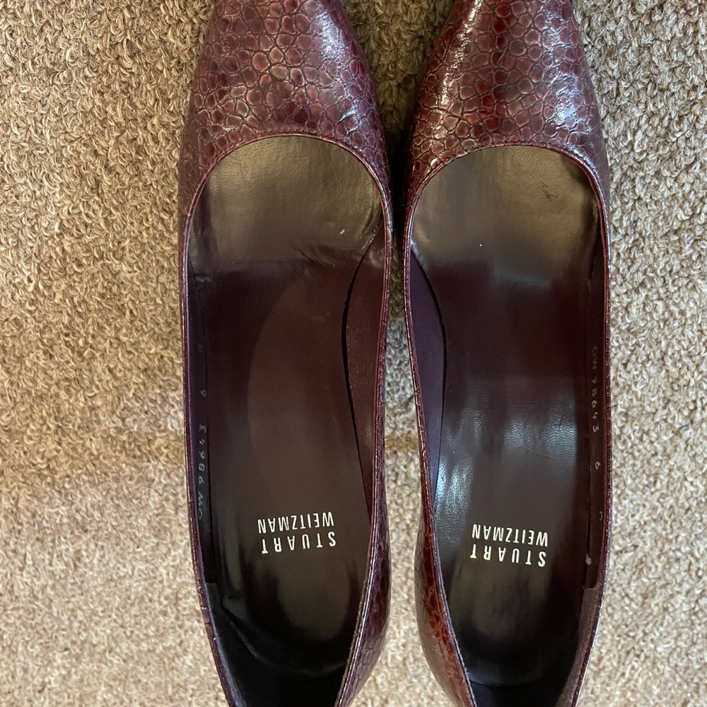 Burgundy, lightly worn Stuart Weitzman heels.